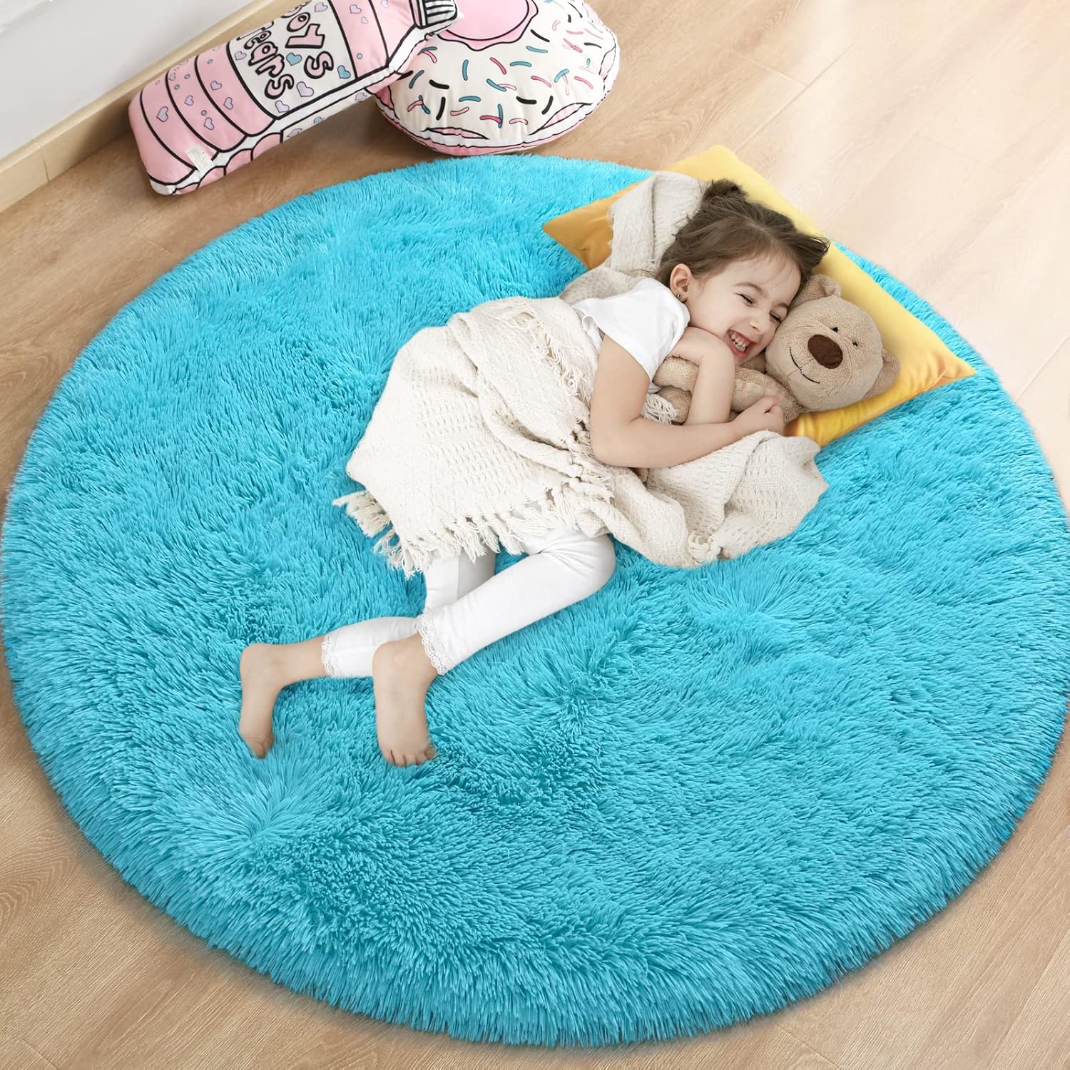 Gifeas blue round fluffy rug front view showcasing the plush circular texture in a brightly lit girls bedroom.
