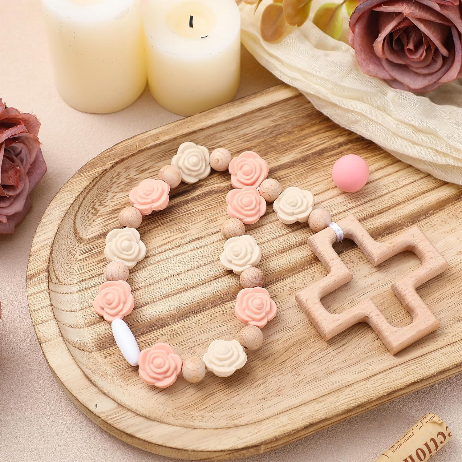 Landical cross baptism silicone rosary front view showing pink rose beads and wooden cross.