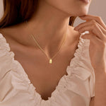 Layered styling demonstration of the Poxtex alphabet letter necklace