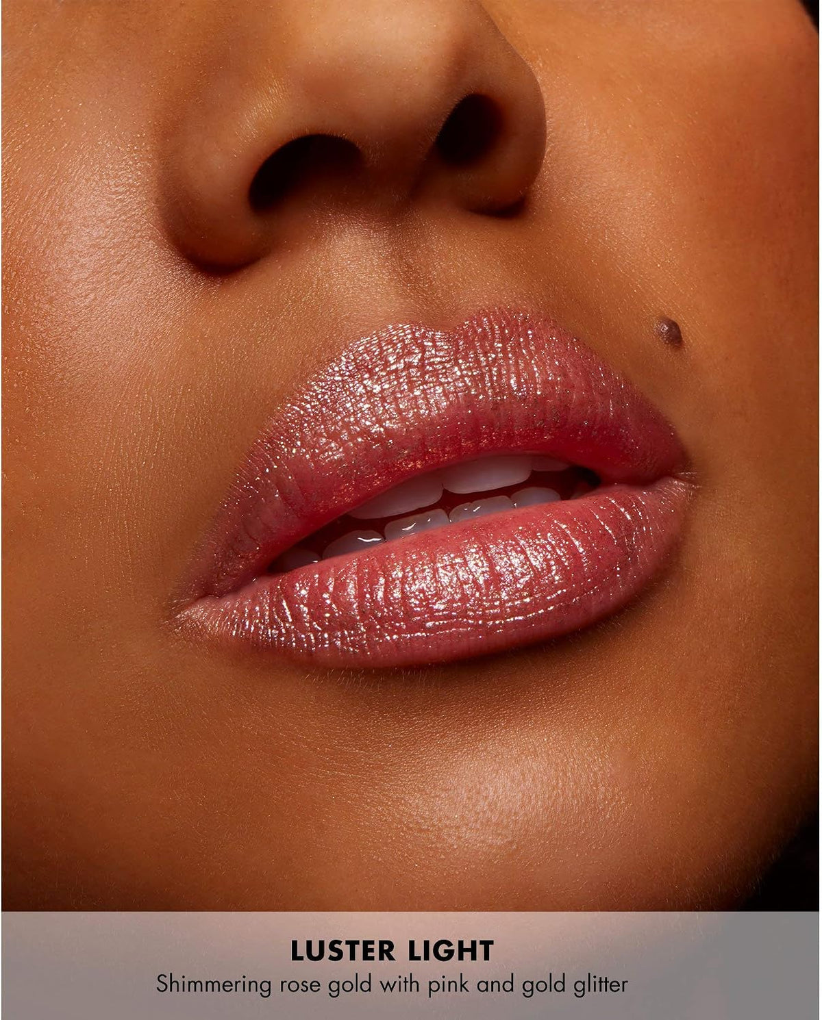 Milani prismatic lip topping glitter applied on bare skin showcasing multi dimensional shifting pearls
