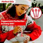Peppermint candy cane stirrers being dipped into a mug of hot chocolate