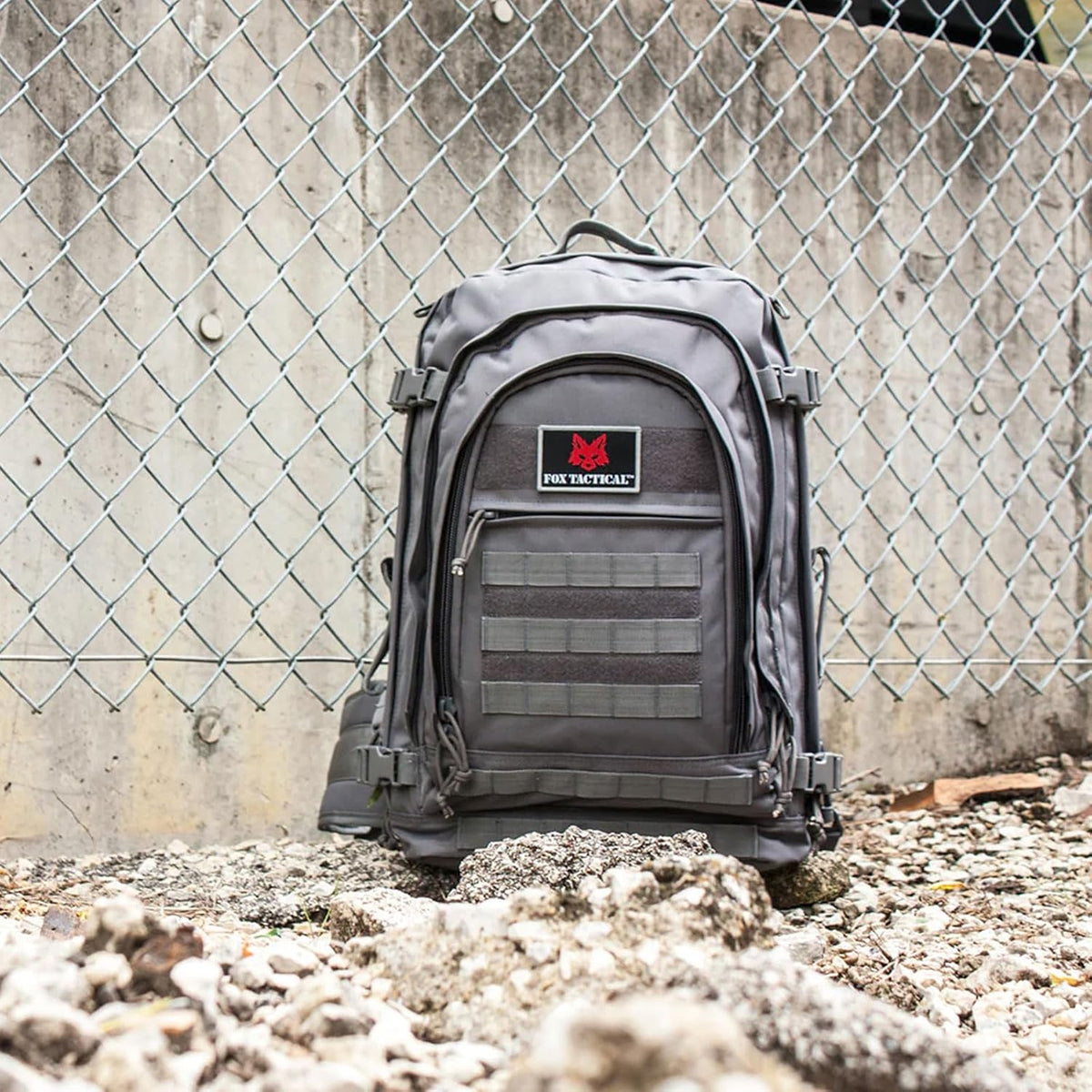 Fox Outdoor 61L field pack side profile showing MOLLE webbing