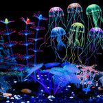 Uniclife 4 Pack Fish Tank Decorations front view of glowing silicone jellyfish and coral plants under blue aquarium lighting.