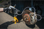 Performance Tool hand vacuum pump connected for brake bleeding