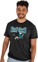 Blue 84 NHL heathered black t-shirt lifestyle styled view for game day