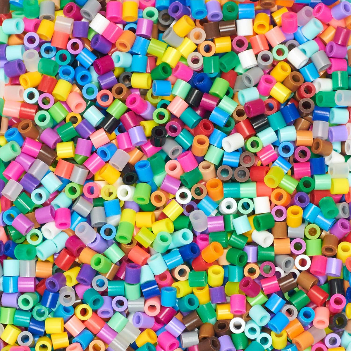 Perler crafting beads poured out showing vibrant colors