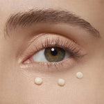 Texture showcase of Clarins Total Eye Smooth 2-in-1 eye balm and mask.