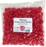 Extra large red cinnamon jelly beans piled in a glass decorative party candy bowl.