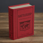 WS Game Company Battleship styled on a modern living room bookshelf