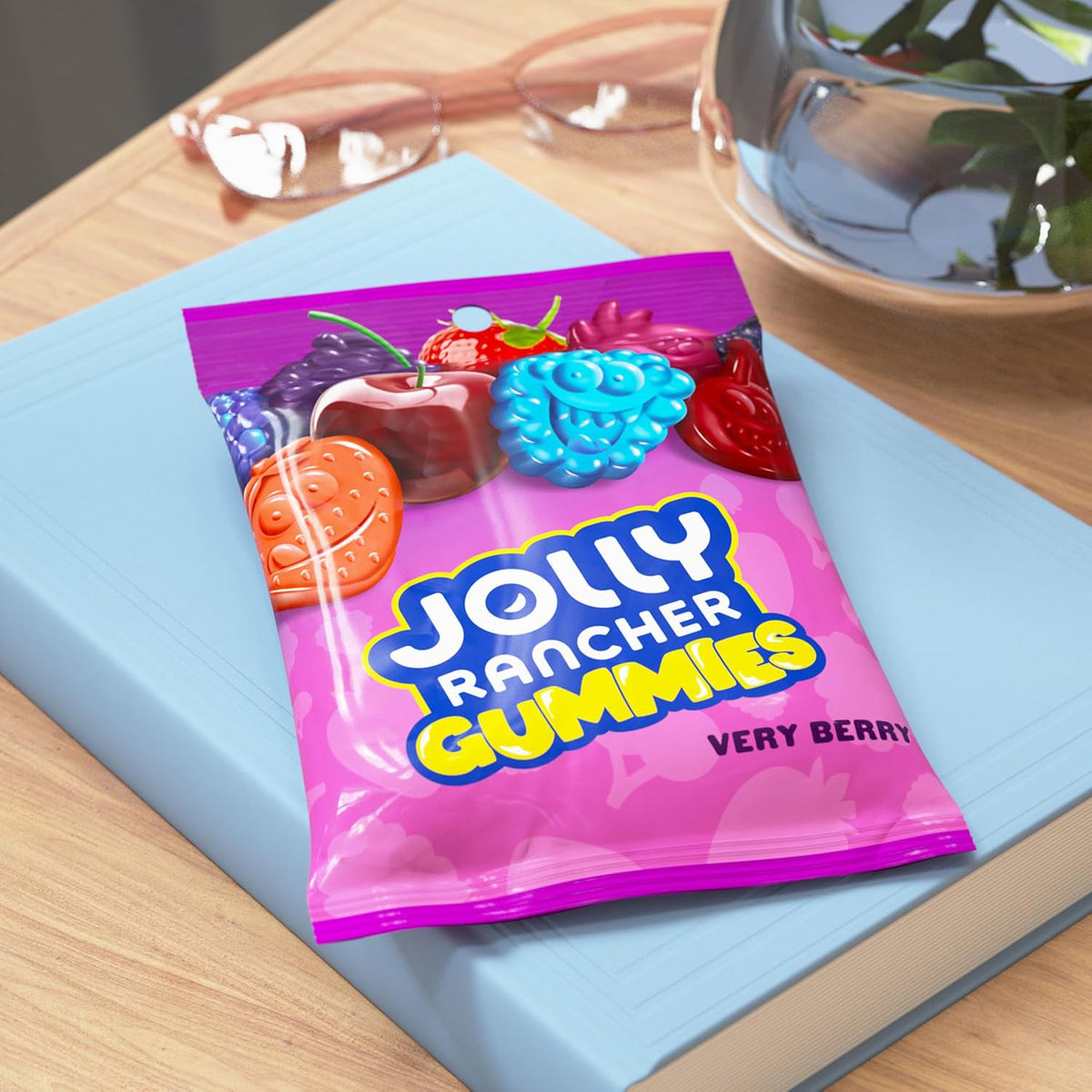 Hand holding a mix of five different imported Jolly Rancher berry candy flavors.