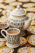 Emma Bridgewater stoneware tea cup close up on typography