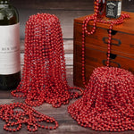 33 inch long red beaded necklace draped for display