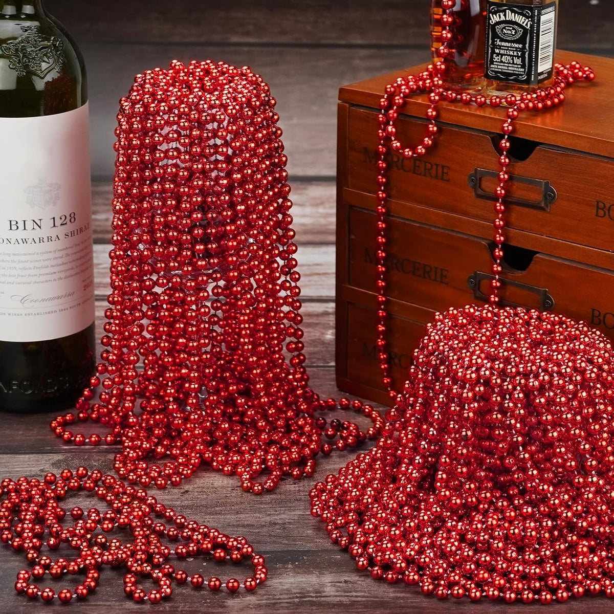 33 inch long red beaded necklace draped for display