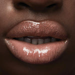 Pink Quartz lip plumper showing the specialized doe foot applicator wand