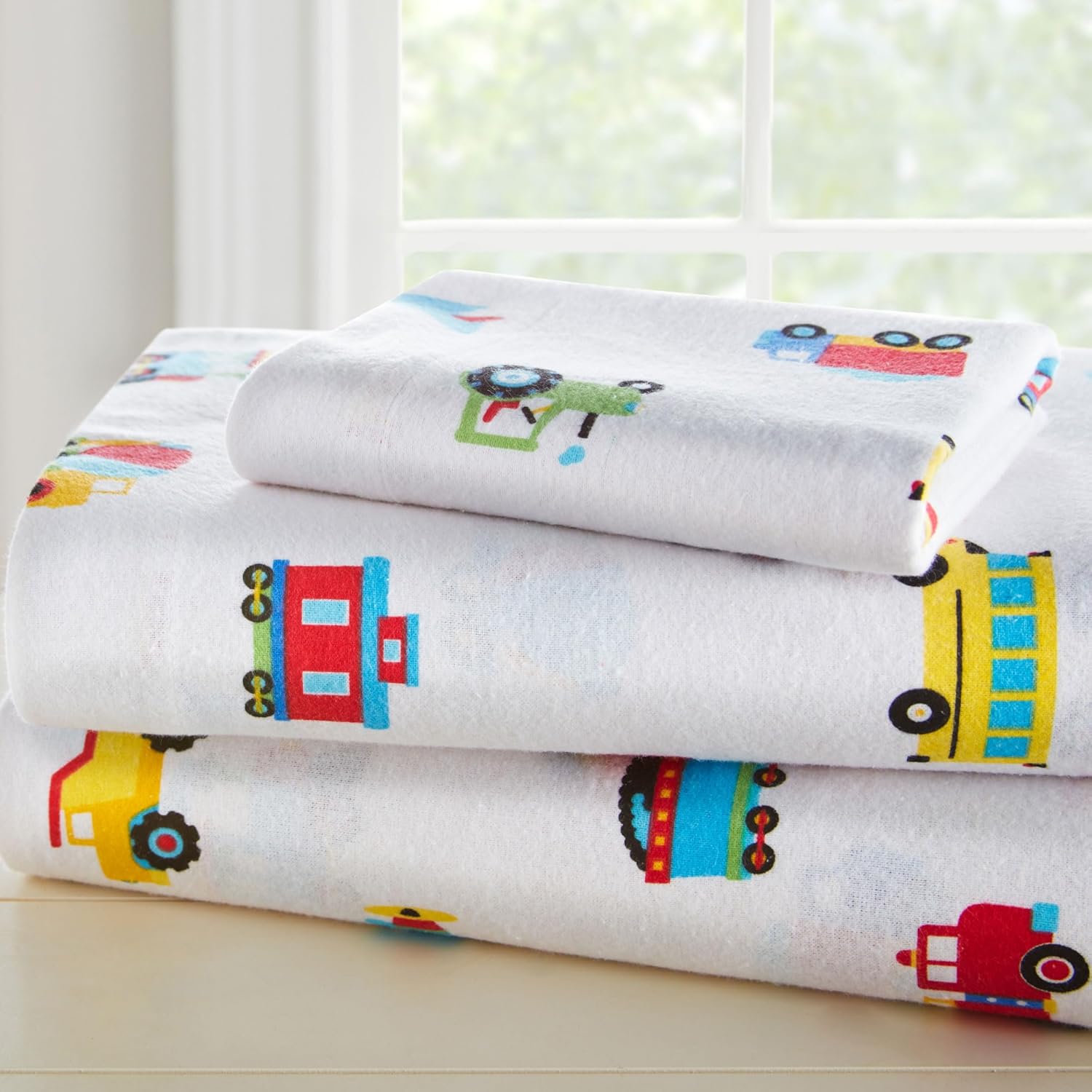 Wildkin flannel toddler sheet set trains planes and trucks front view