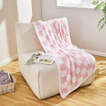 Side angle view showcasing the medium-weight stretch and thickness of the blanket