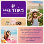 Warmies 13 inch Triceratops plush held for size reference