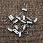 Side angle view of through-hole crystal resonator pins