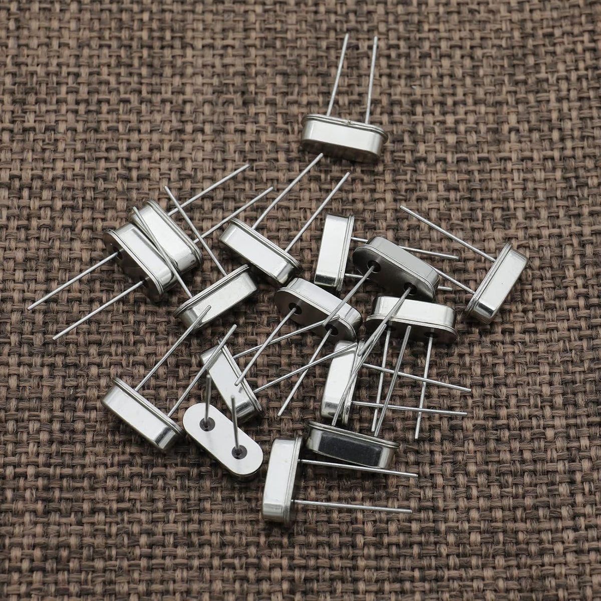 Side angle view of through-hole crystal resonator pins