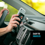 Nite Ize Steelie Squeeze Clamp attached to car dashboard