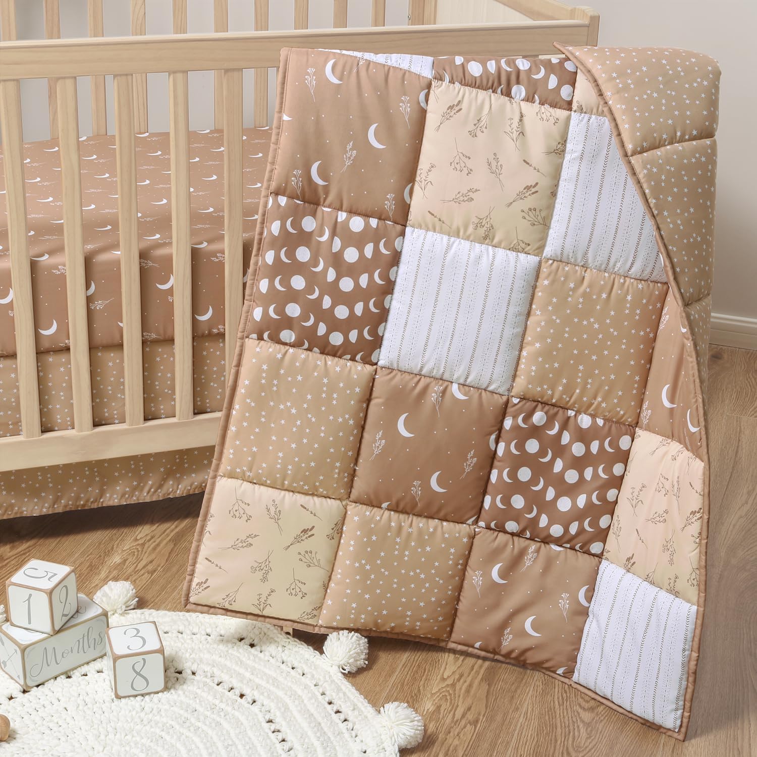 The Peanutshell 3 Piece Baby Crib Bedding Set front view of boho celestial nursery decor