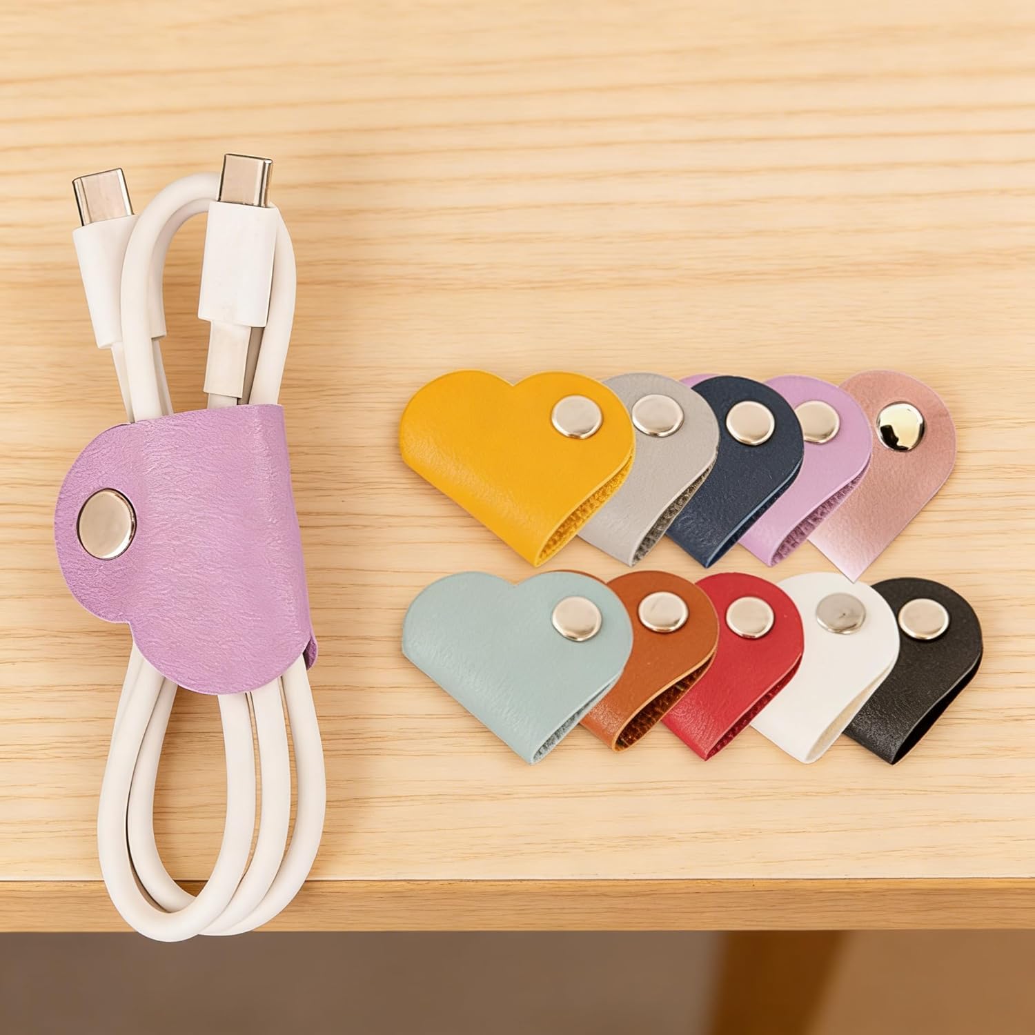 Unknown Brand heart cord organizers front view showing multi color leather straps wrapped around USB cables