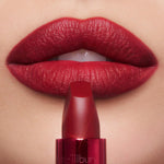 Close up view of luxury imported Charlotte Tilbury matte lipstick packaging and branding.