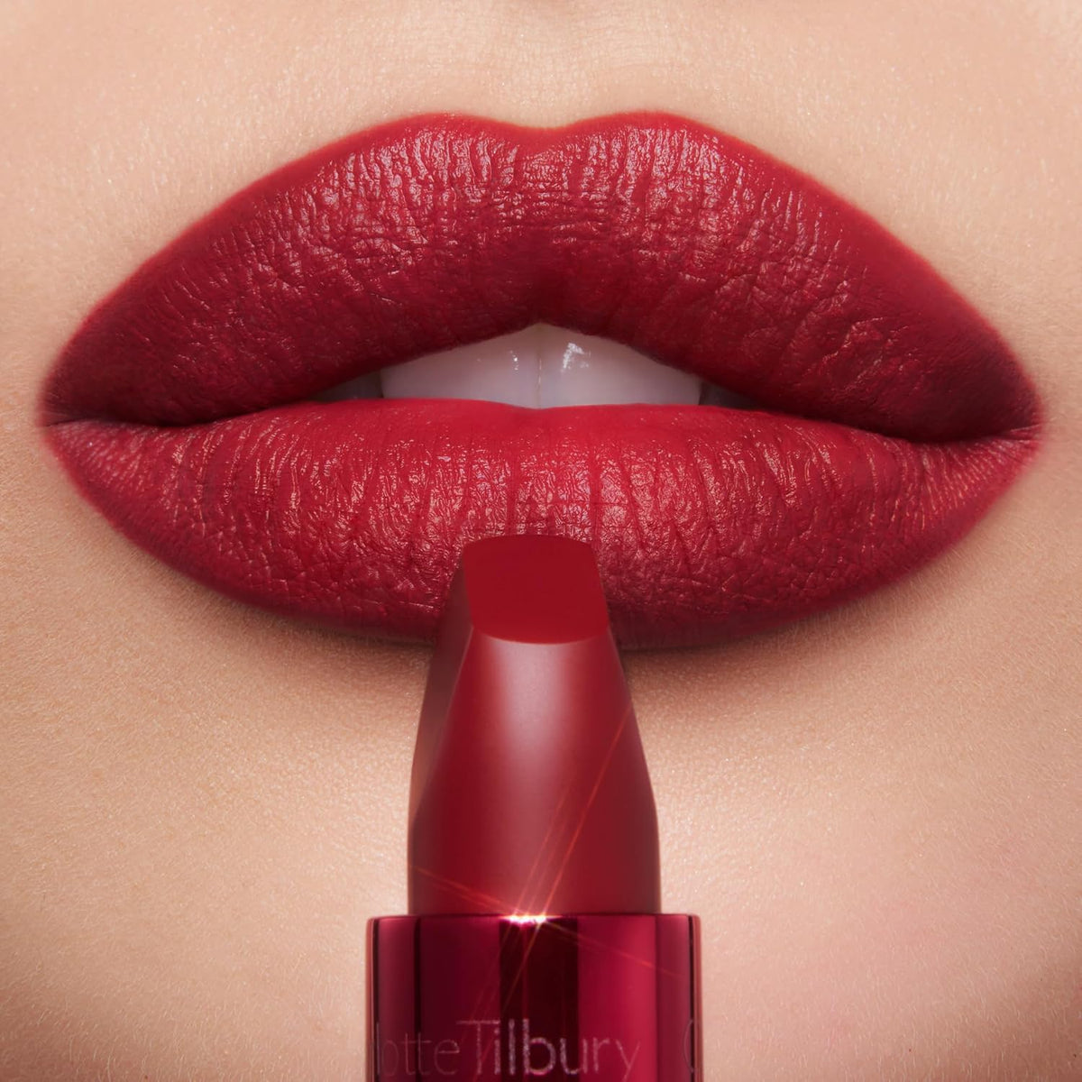 Close up view of luxury imported Charlotte Tilbury matte lipstick packaging and branding.