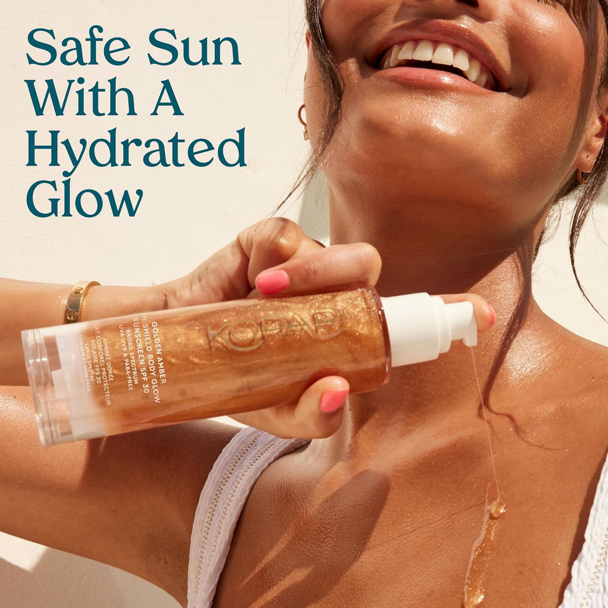 Model applying Kopari Sun Shield Body Glow SPF 30 gel onto arm