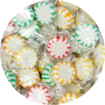 A handful of LaetaFood Arcor Starlight Peppermint hard candies showcasing the twist wrap packaging