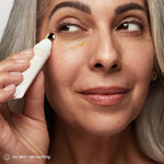 Applying the firming eye cream with bio retinol under the eye area