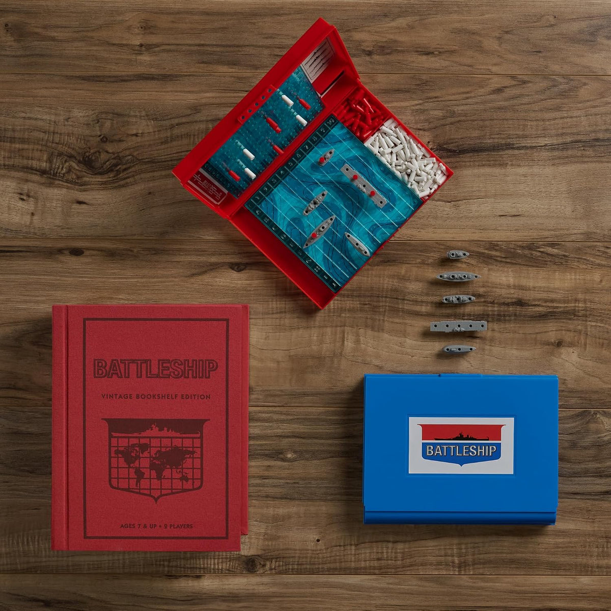 WS Game Company Battleship game components including plastic ships and pegs