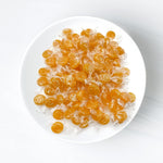 Close up of yellow butterscotch hard candy texture