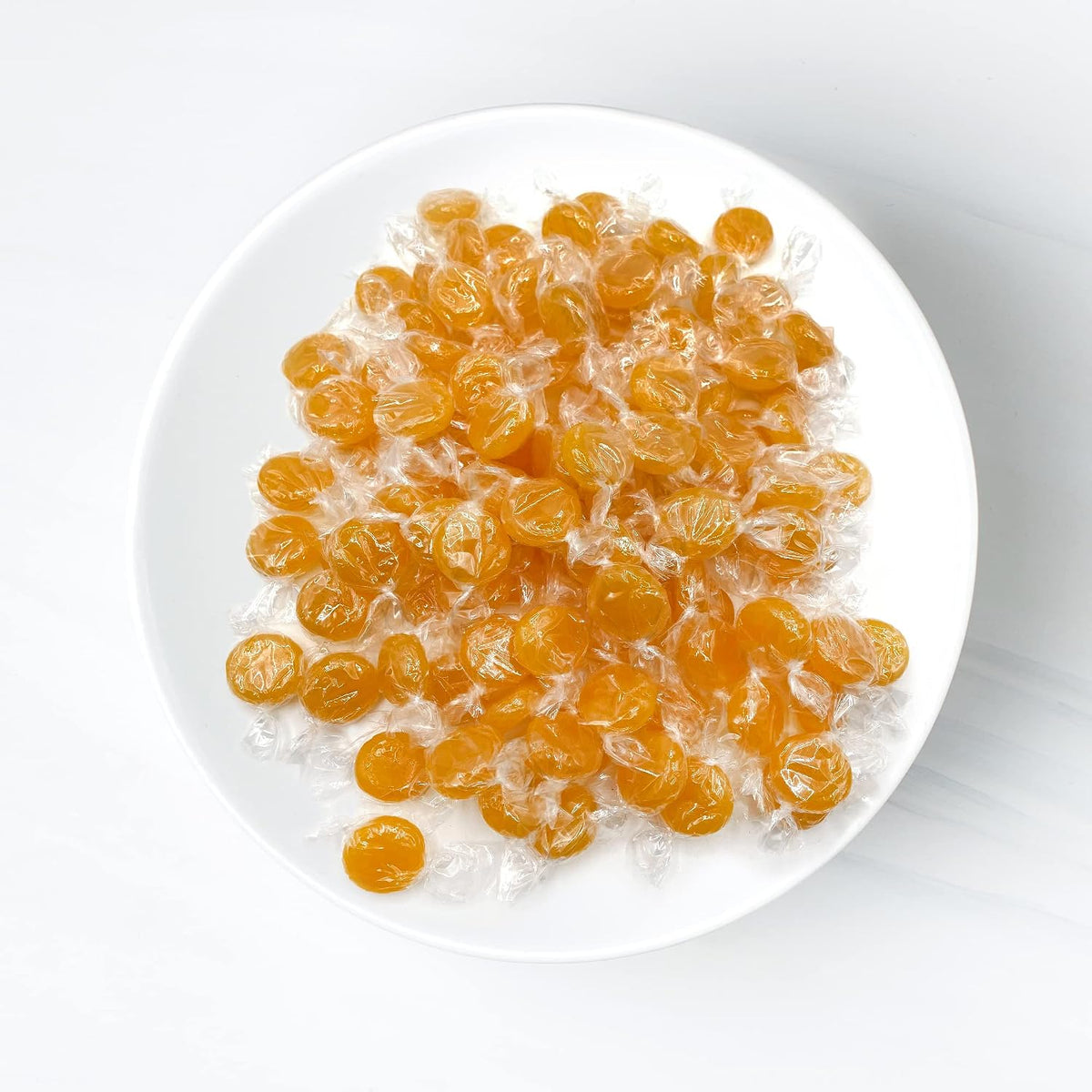 Close up of yellow butterscotch hard candy texture