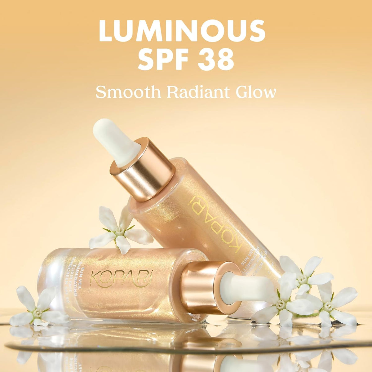 Kopari Sun Veil Illuminating Elixir Face Sunscreen dropper bottle and texture display