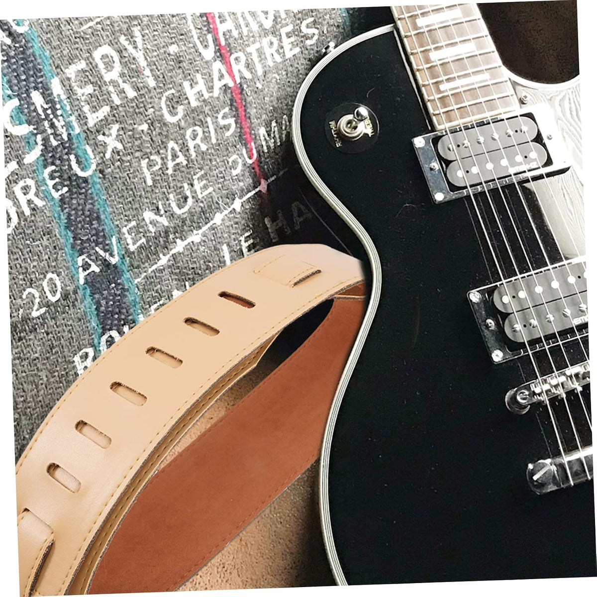 Ibasenice guitar strap attached to acoustic guitar body