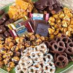 Assorted gourmet chocolates and caramel popcorn snack tray