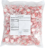 Individually wrapped LaetaFood Arcor Starlight Peppermint Mints scattered on a table