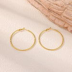 Gacimy round gold hoops angled perspective showing slim 1.8mm profile
