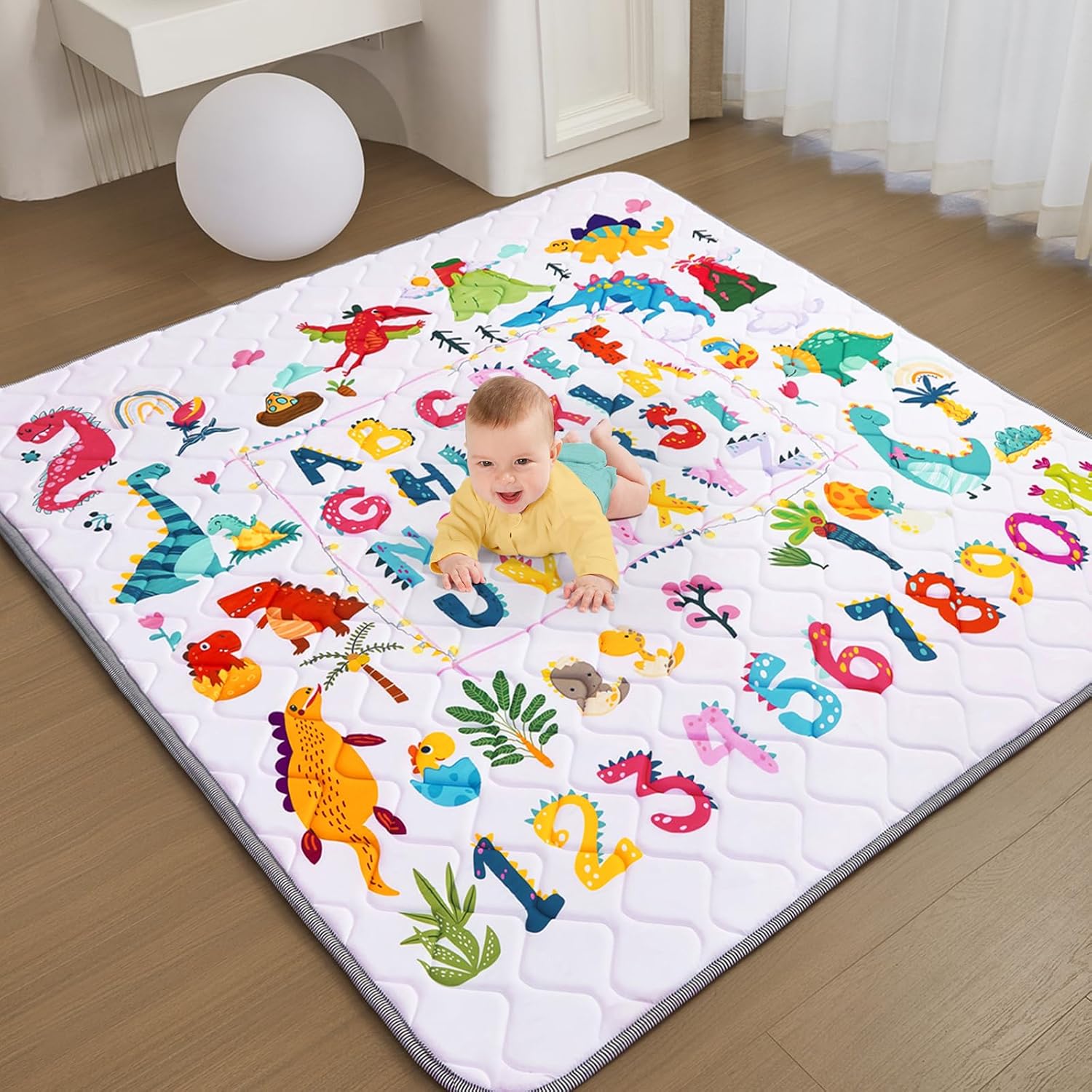 TreeBud baby play mat featuring dinosaur and alphabet pattern front view