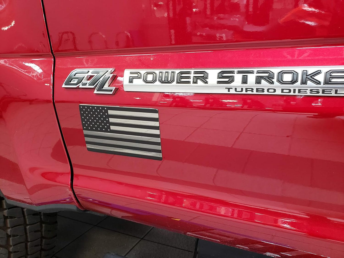Exterior vehicle window and bumper placement example of flag badge