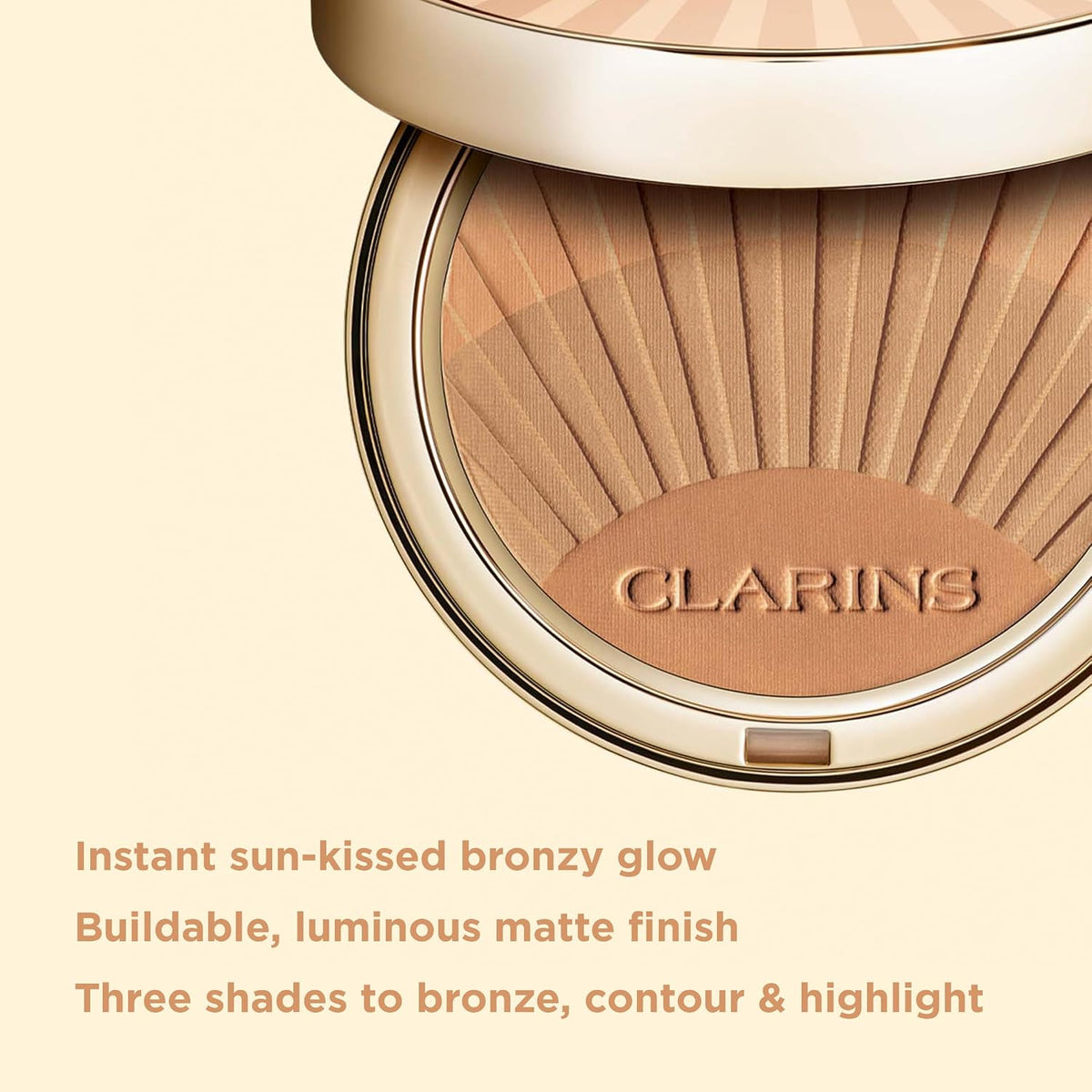 Clarins Bronzing Powder open compact showing three gradient shades
