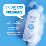 White dog being washed with Veterinary Formula whitening shampoo