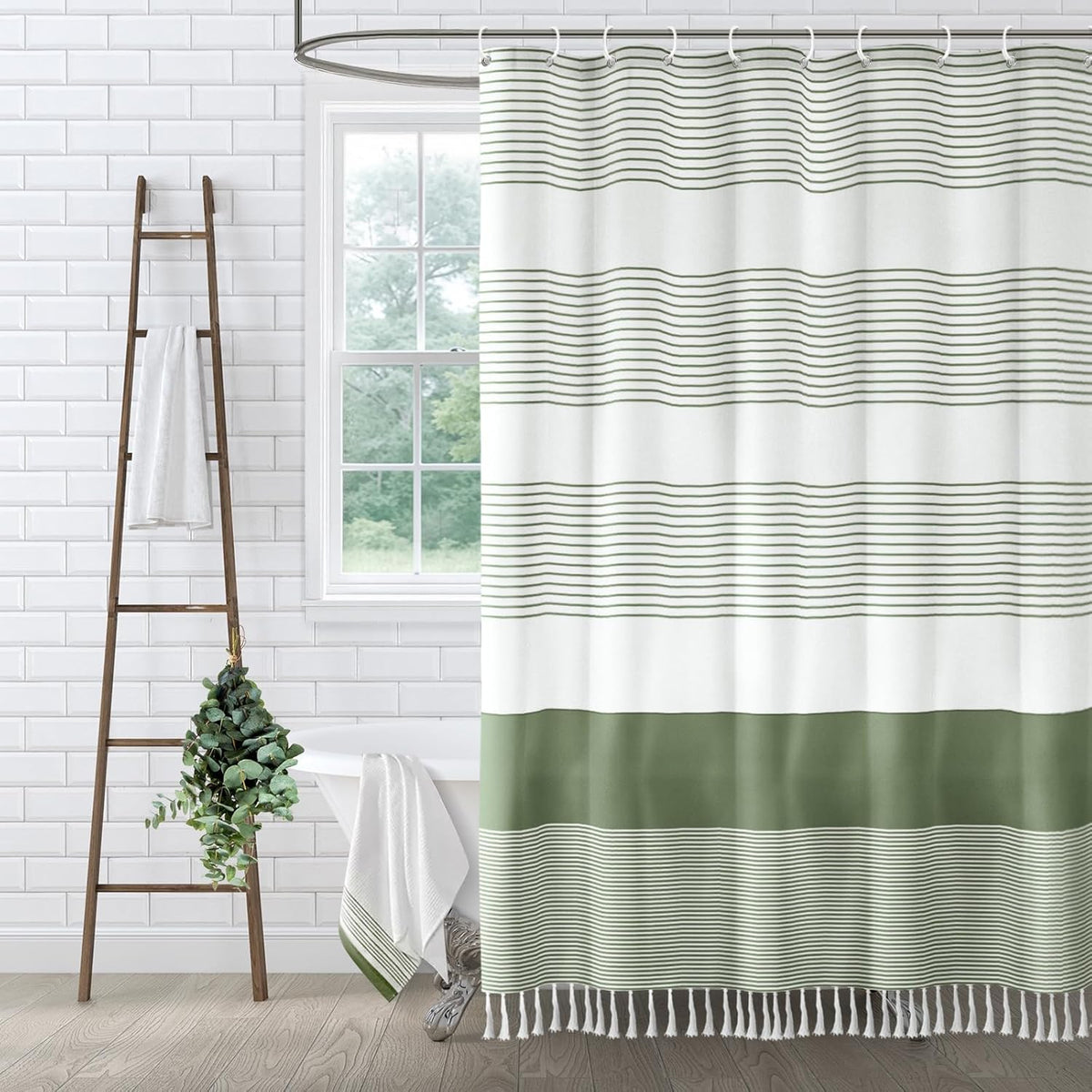 XOGUIBO sage green boho striped shower curtain front view hanging inside a modern farmhouse styled bathroom layout.