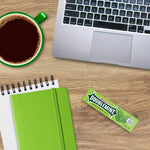 An individual five stick pack of original USA imported Wrigley's Doublemint chewing gum held up clearly.