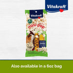 Small pet chewing on an unpopped Vitakraft Mini Pop corn cob enrichment toy.