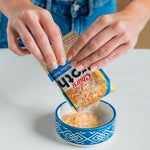 Cat eating Inaba Churu Broth as a meal topper