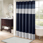 Madison Park Amherst Navy Shower Curtain front view hanging in modern bathroom