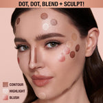 Model applying Charlotte Tilbury contour wand to cheekbone