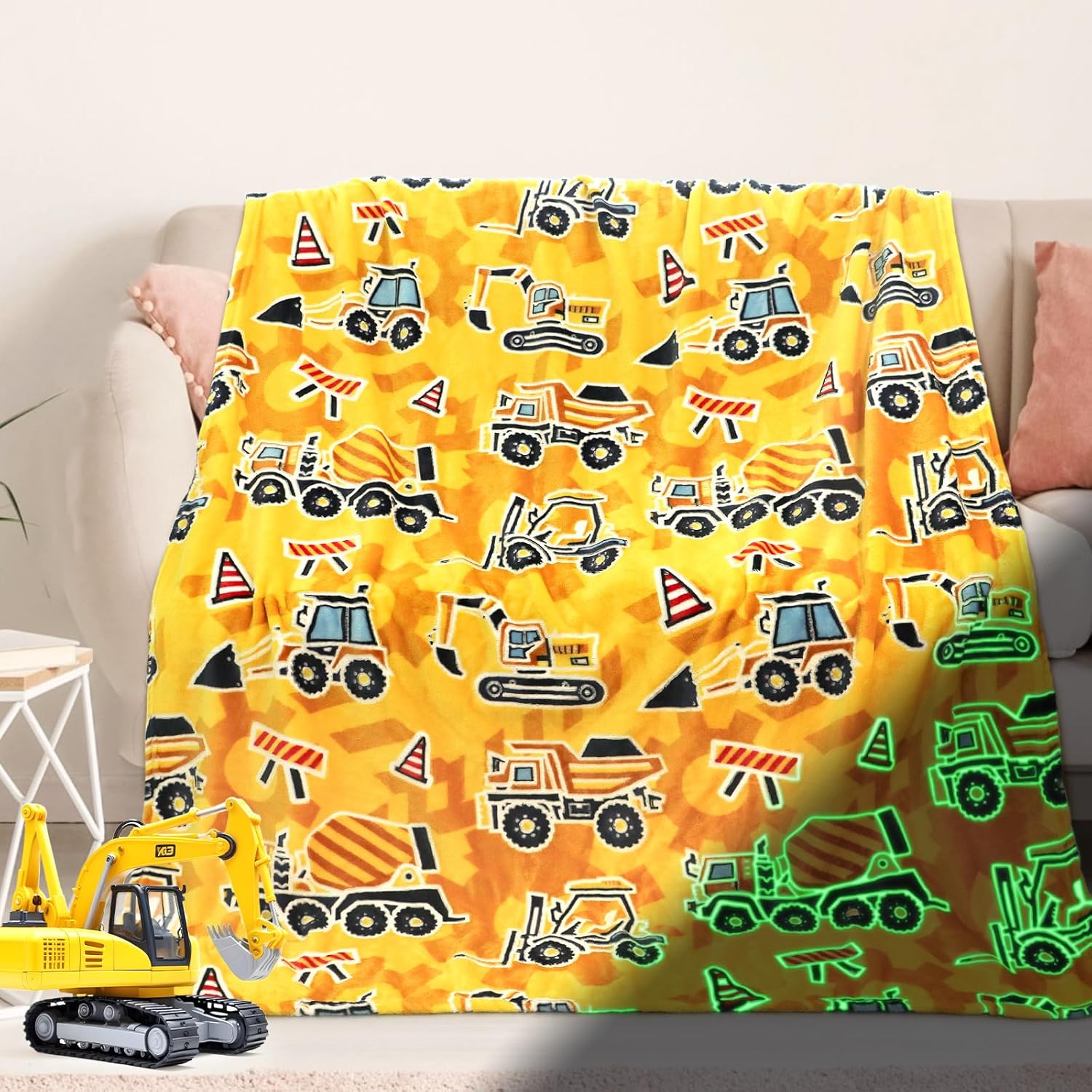 DESKSA glow in the dark excavator blanket front view showing yellow and orange construction truck designs.